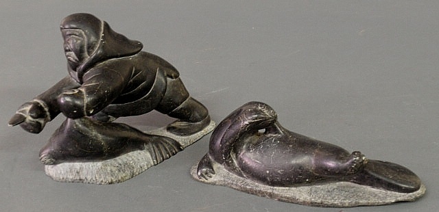Carved stone Eskimo with seal