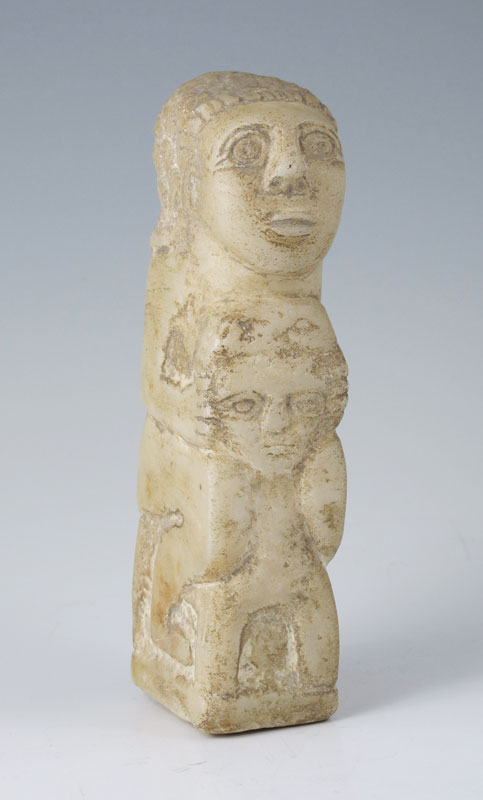 CARVED STONE FIGURE OF BA'AL HAMMON