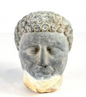 CARVED STONE HEAD OF A YOUTH,