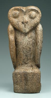 Carved stone owl, surface with tool