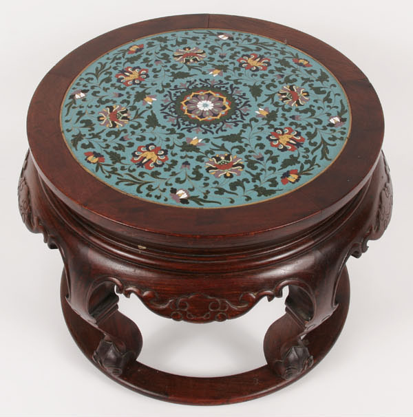 Carved table with round cloisonne