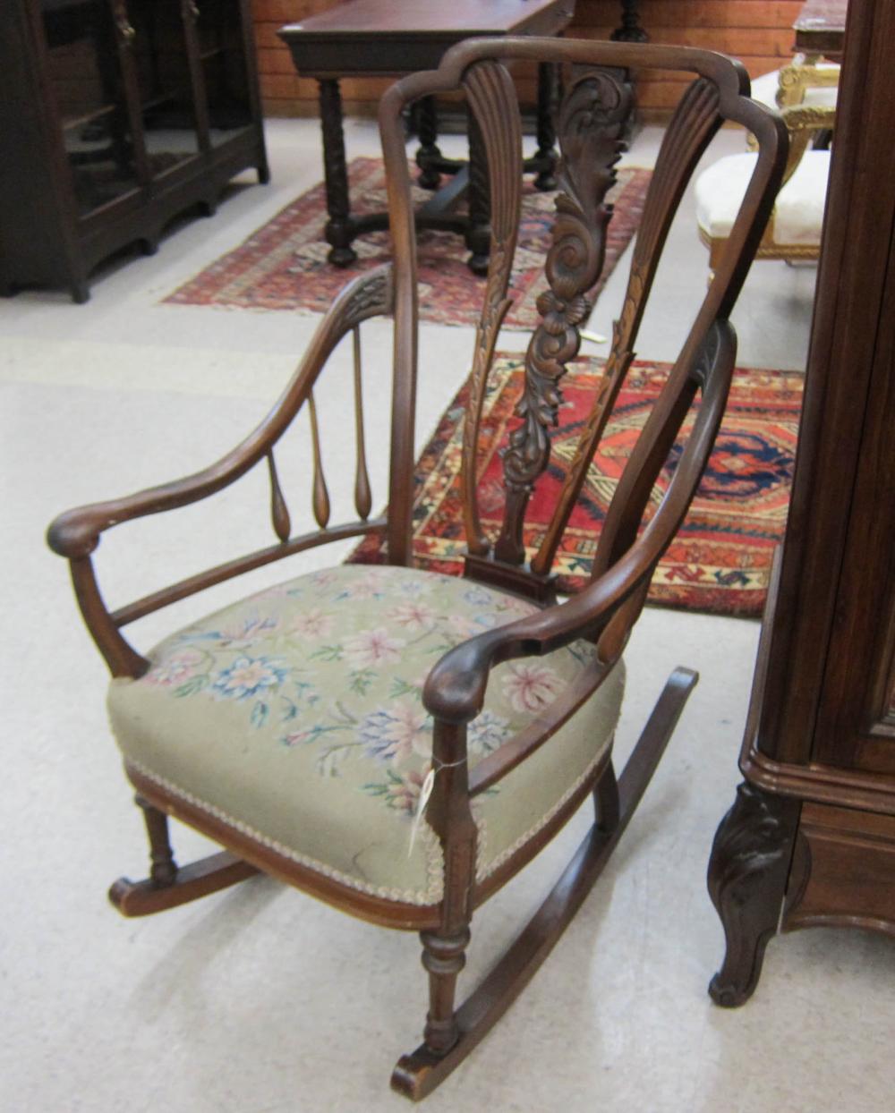 CARVED WALNUT ARMCHAIR ROCKER,