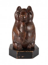 CARVED WALNUT FOLK ART BEAR, A