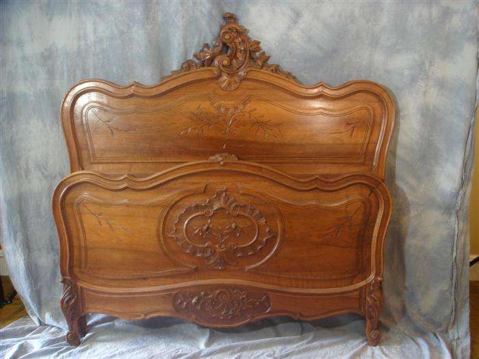 Carved walnut French bed, 58"h  