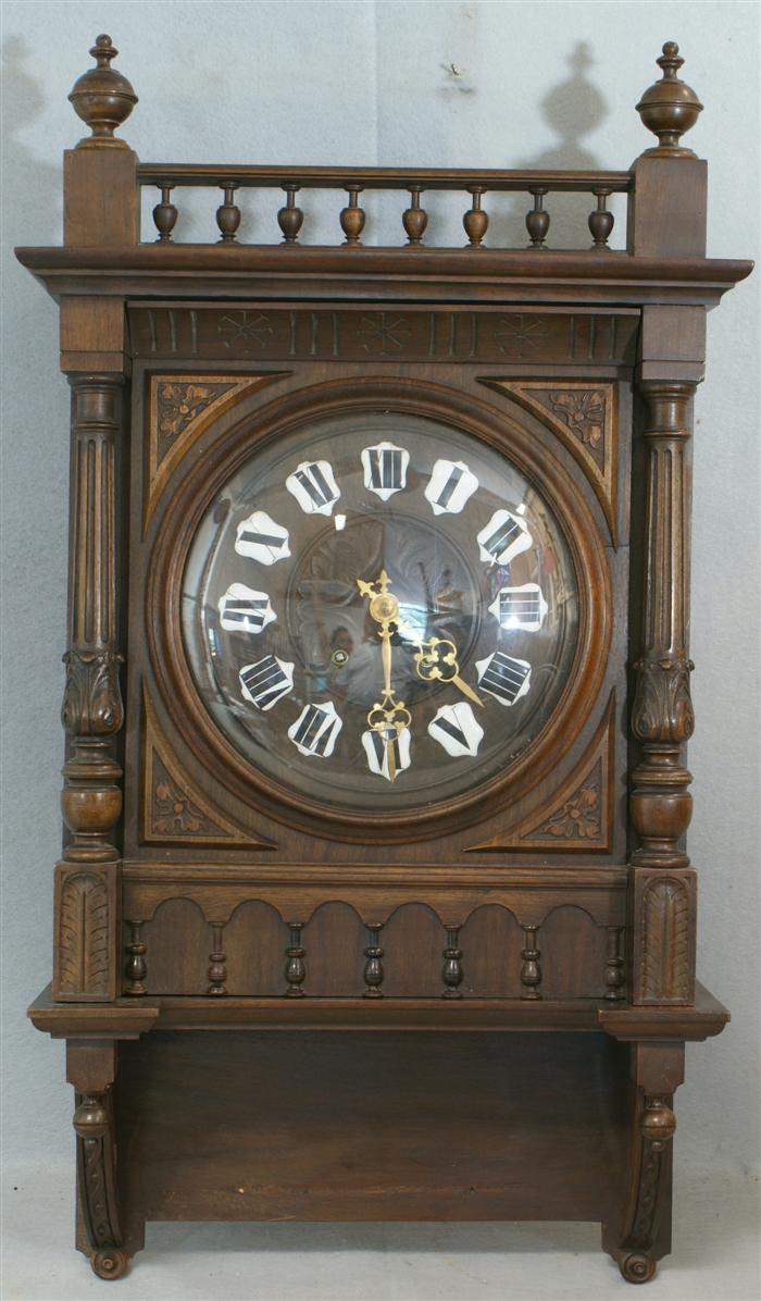 Carved walnut German wall clock,
