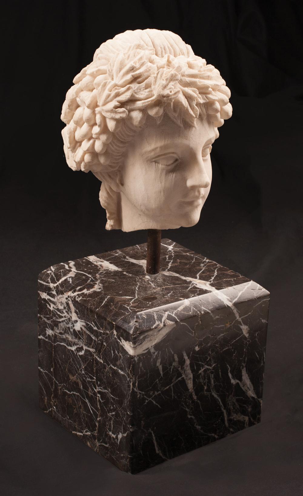 CARVED WHITE MARBLE HEAD OF A