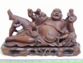 CARVED WOOD BUDDHA FIGURE ON C