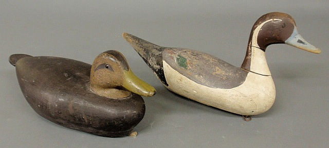 Carved wood decoy of a black duck