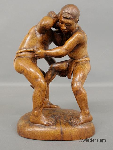 Carved wood figural group of two