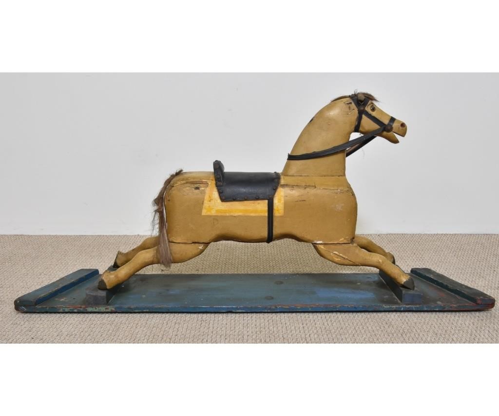 Carved wood rocking horse with