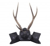CARVED WOOD SCULPTURE OF A SAM