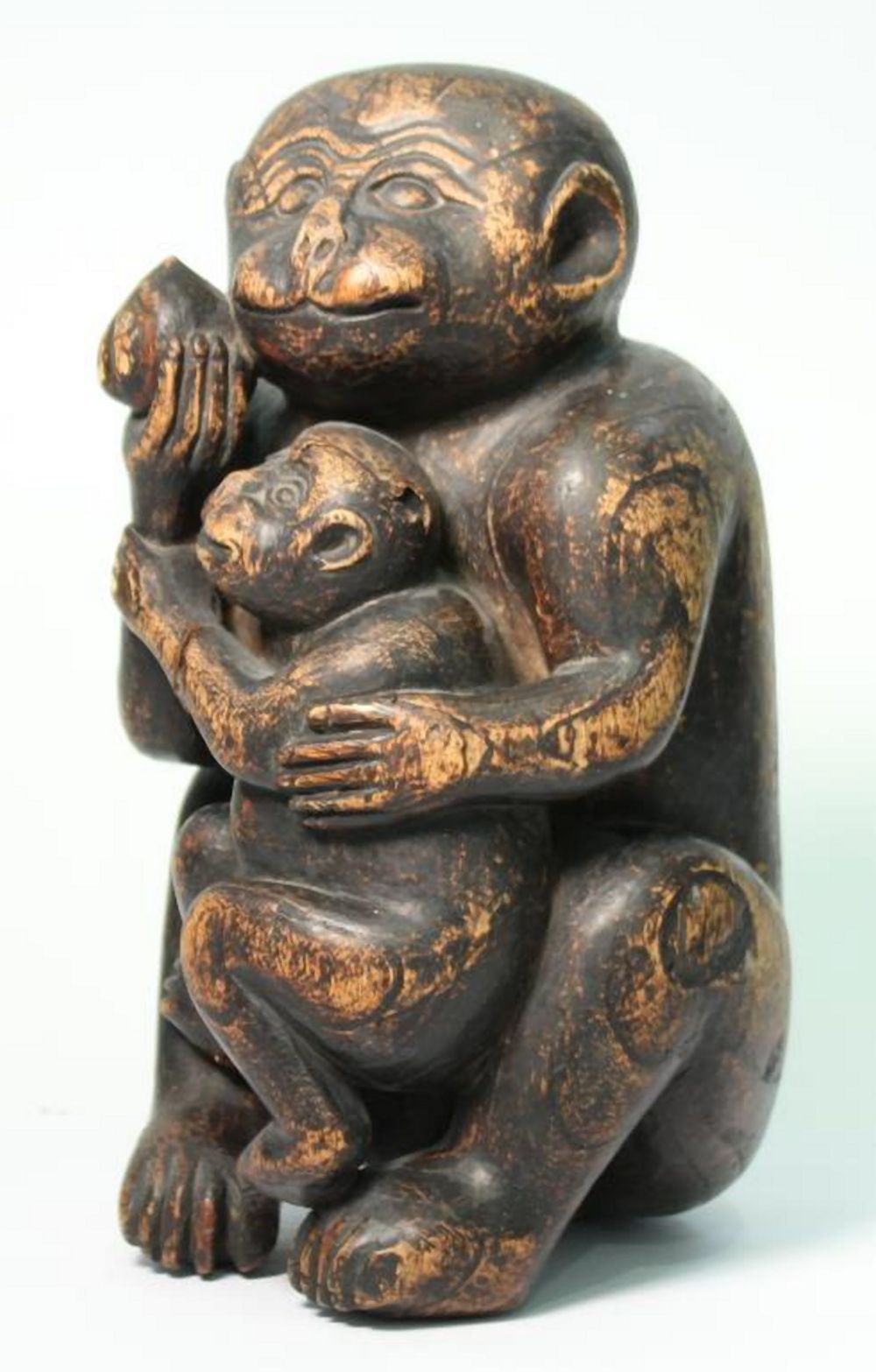 CARVED WOOD SCULPTURE OF A