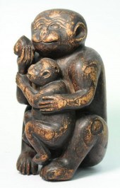 CARVED WOOD SCULPTURE OF A MON