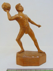 CARVED WOOD SHOT PUT FIGURE BY