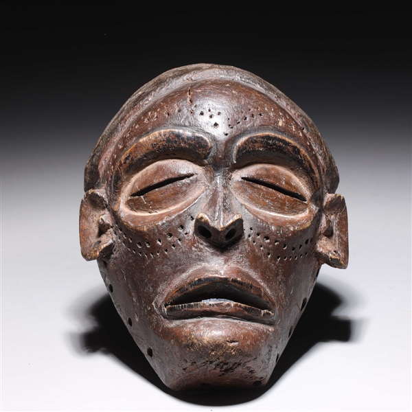 Carved wood West African Dan mask