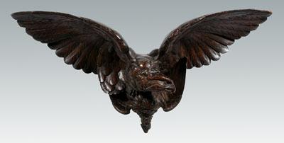 Carved wooden eagle, carved feather