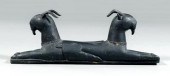 Carved wooden goats, two carve