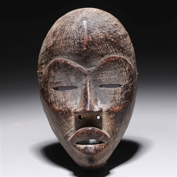 Carved wooden mask in the style