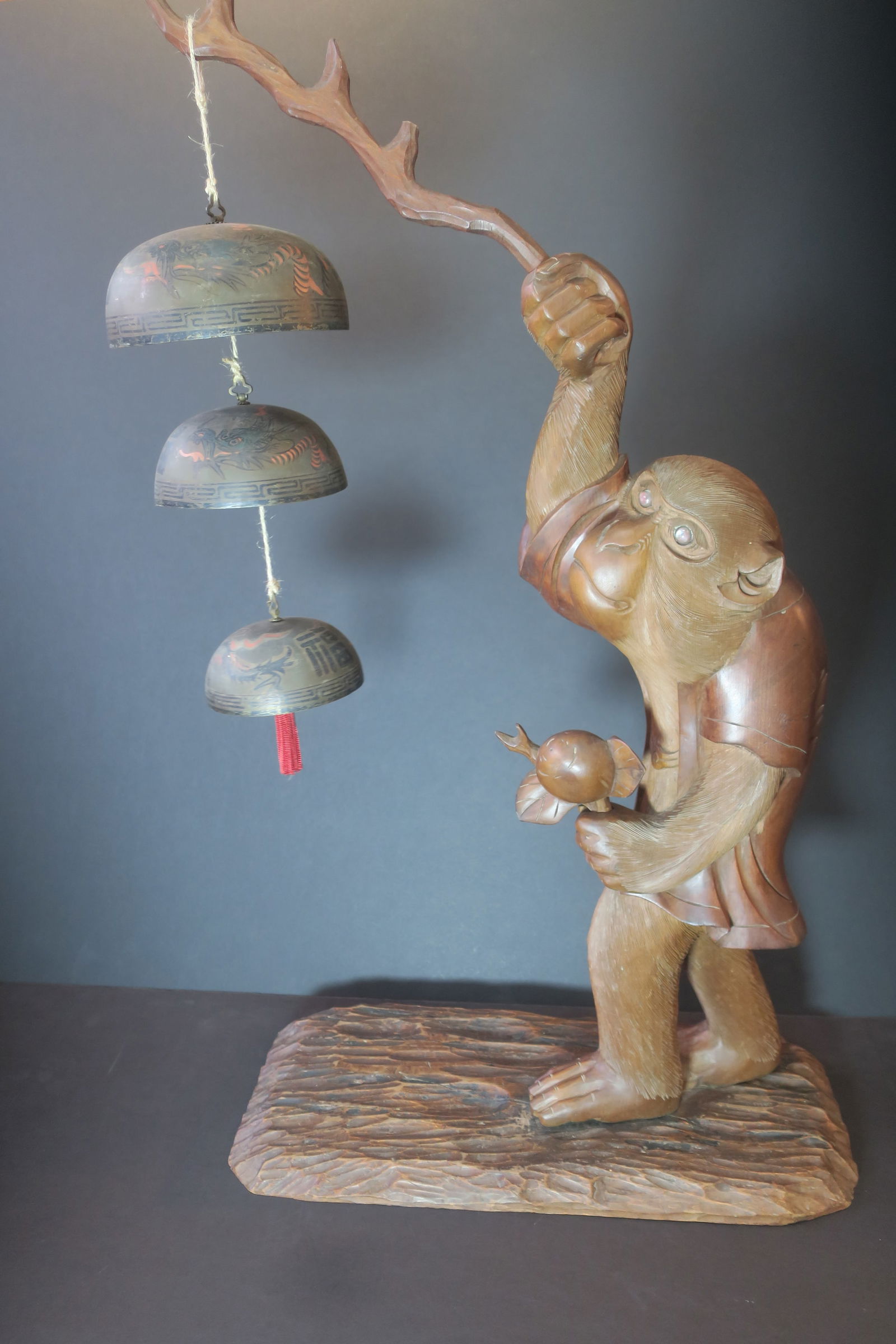 CARVED WOODEN MONKEY WITH TEMPLE
