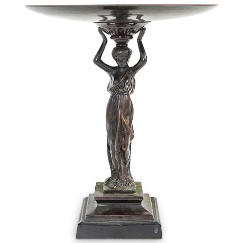 CARYATID FOOTED METAL