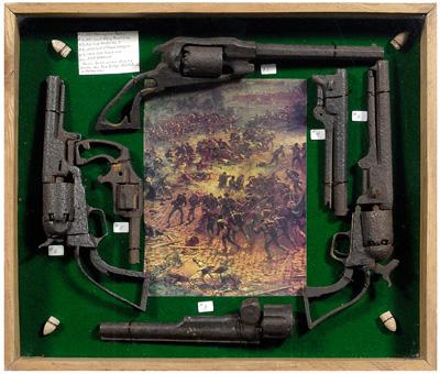 Case with dug relics: four handguns