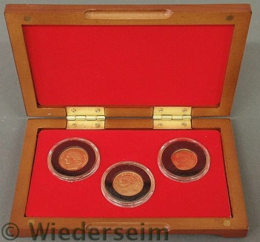 Cased set of three Swiss gold coins