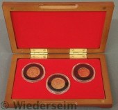 Cased set of three Swiss gold