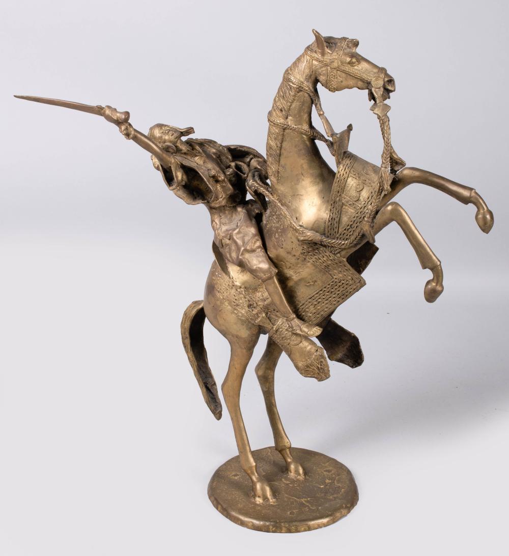 CAST BRASS FIGURE OF A RIDER ON A