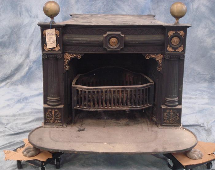Cast iron and brass parlor stove,