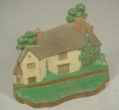 Cast iron doorstop and two boo