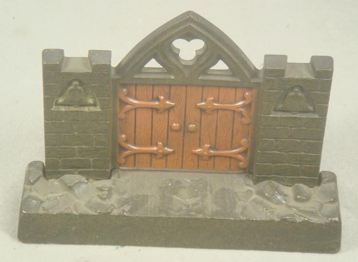 Cast iron doorstop, brown and