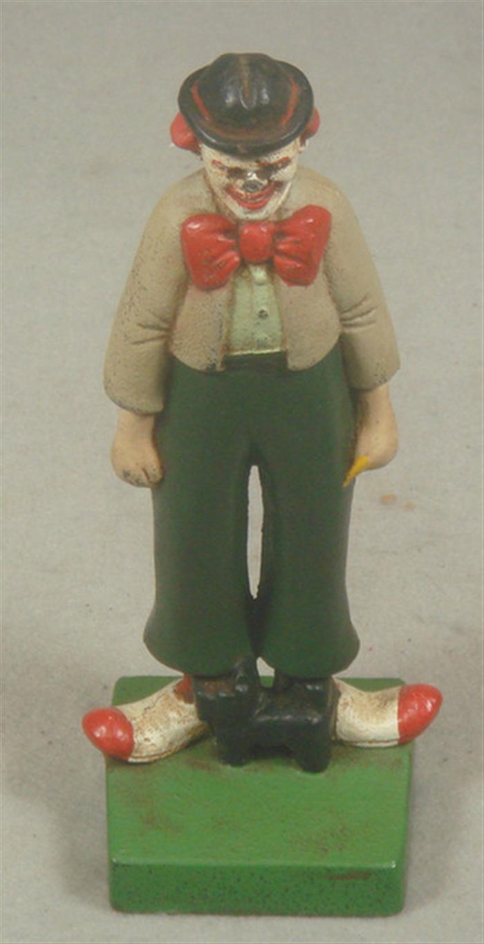 Cast iron doorstop, clown with