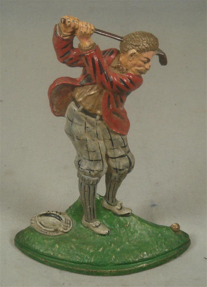 Cast iron doorstop, golfer in