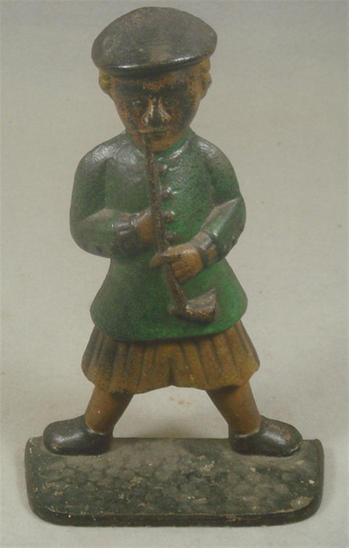 Cast iron doorstop, large man in