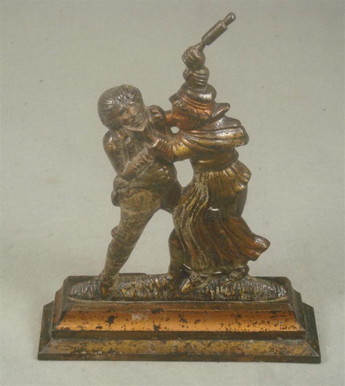 Cast iron doorstop, man and woman