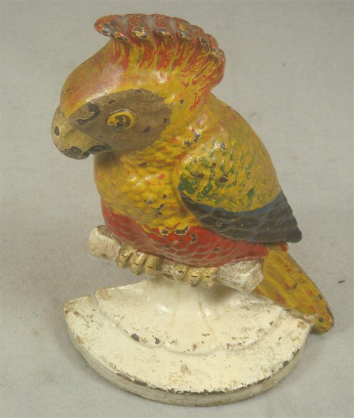 Cast iron doorstop, parrot perching