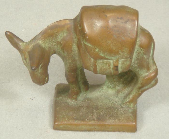 Cast iron doorstop, small brass