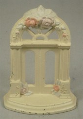 Cast iron doorstop, tan and fl