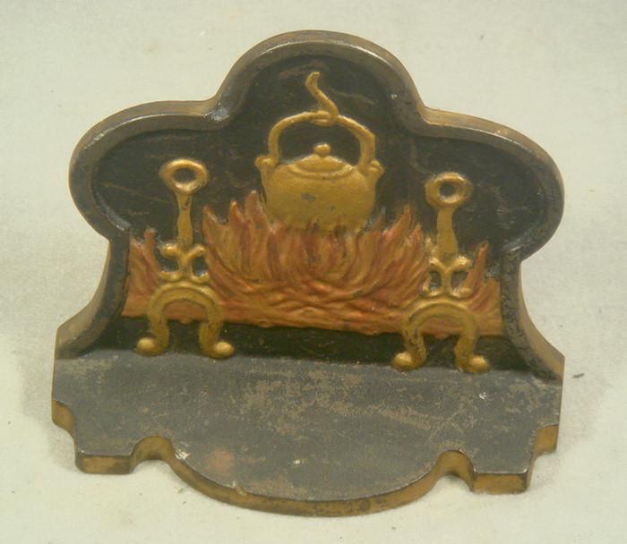 Cast iron doorstop, tea kettle in