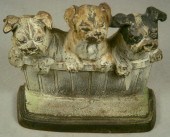 Cast iron doorstop, three pupp