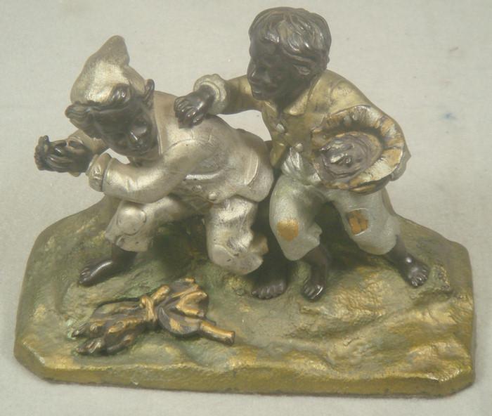 Cast iron doorstop, two barefoot