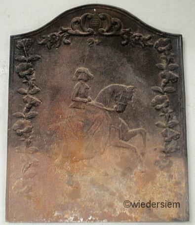 Cast iron fireback with a