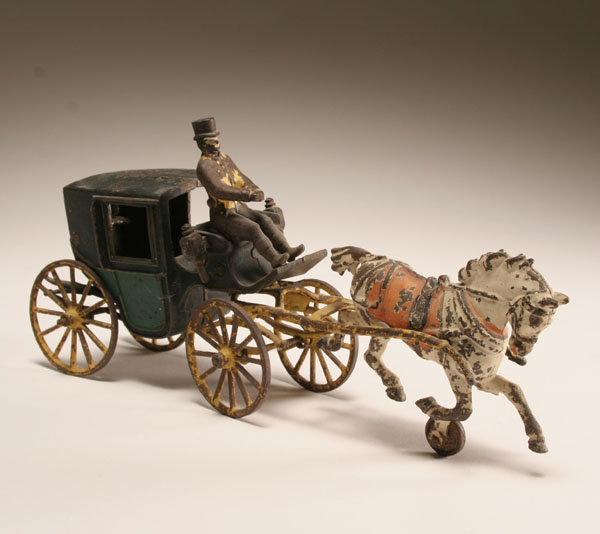 Cast iron horse drawn carriage; two
