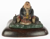 CAST IRON INKWELL OF GLUTTON D