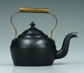 Cast iron kettle with brass ha