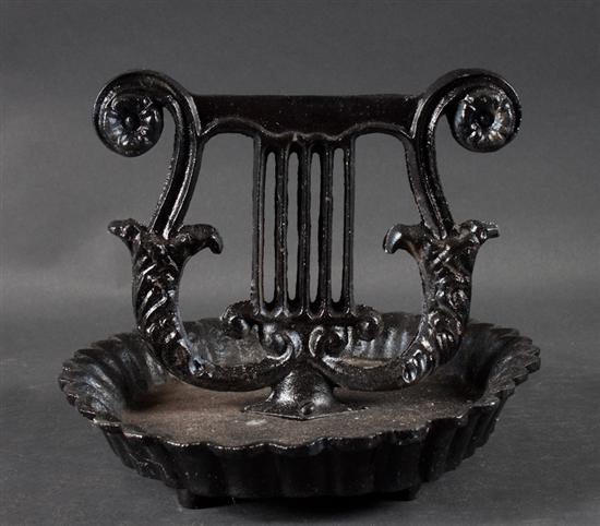 Cast iron lyre-form boot scrape and