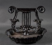 Cast iron lyre-form boot scrap