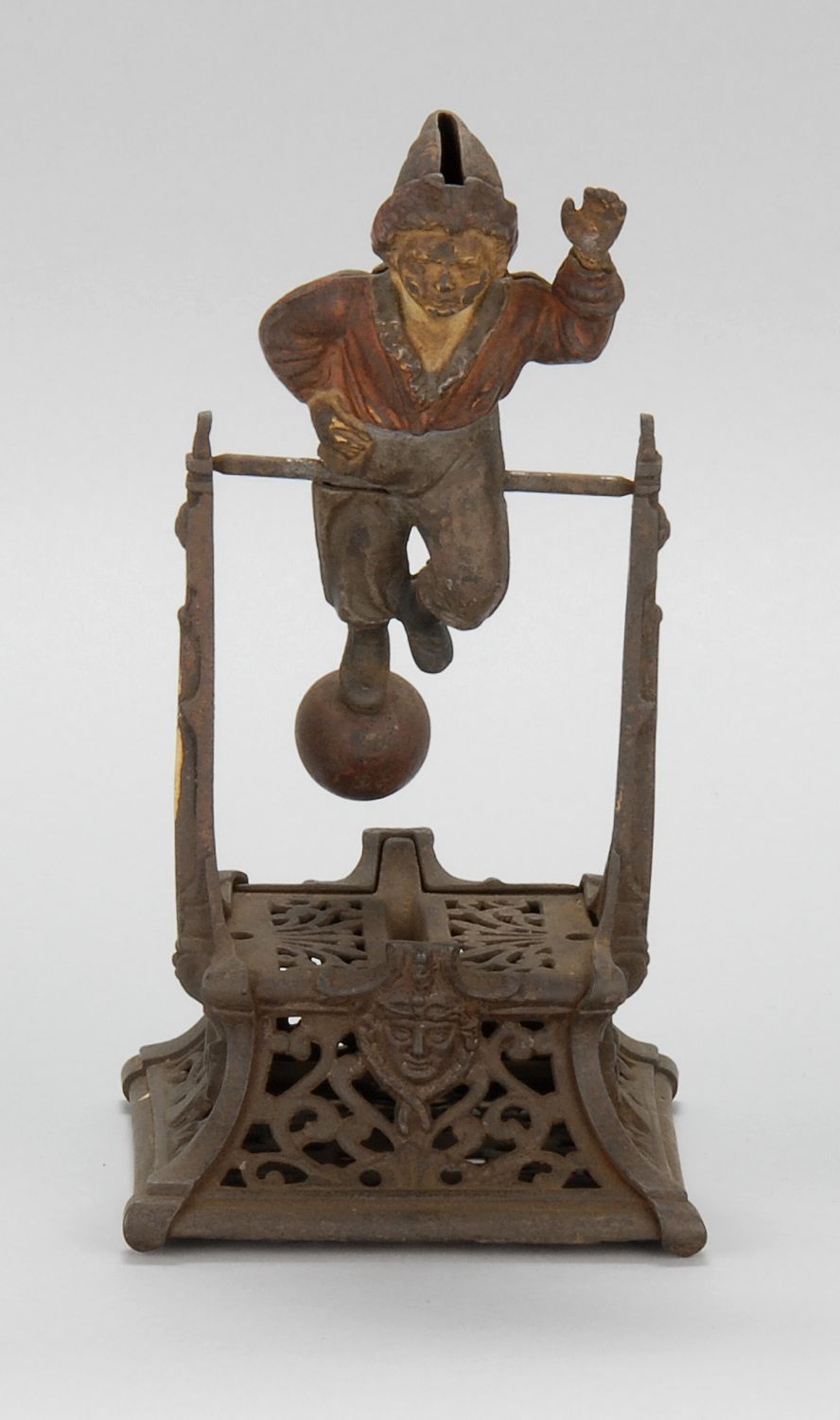 CAST IRON MECHANICAL BANK BOY ON