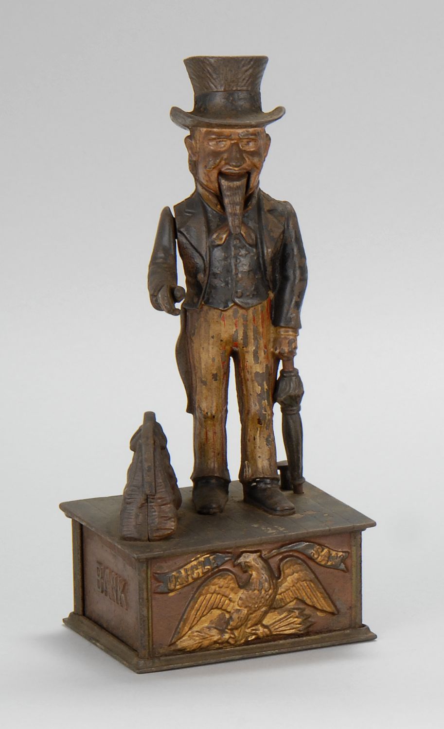 CAST IRON MECHANICAL BANK UNCLE