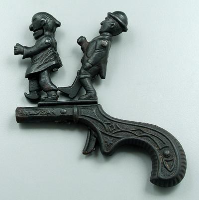 Cast iron novelty pistol, marked on